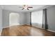 Inviting living room with hardwood floors, natural light from large windows, and neutral wall color at 4044 Roamin Dr, Greenwood, IN 46142