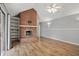 Inviting living room featuring a brick fireplace, built-in shelving, and natural light at 4044 Roamin Dr, Greenwood, IN 46142