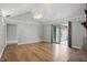 Bright and airy living room with hardwood floors, neutral tones, and access to a patio at 4044 Roamin Dr, Greenwood, IN 46142