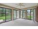 Bright sunroom featuring multiple glass sliding doors with a ceiling fan at 4044 Roamin Dr, Greenwood, IN 46142