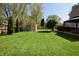 Spacious backyard featuring a storage shed, mature trees, gazebo, and a hot tub at 4257 Locust Ln, Brownsburg, IN 46112