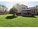 Expansive backyard featuring a gazebo with outdoor seating, a hot tub, and ample lawn space at 4257 Locust Ln, Brownsburg, IN 46112