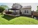 Backyard features a covered gazebo with outdoor seating and a well-maintained lawn at 4257 Locust Ln, Brownsburg, IN 46112