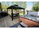 Relaxing backyard featuring a gazebo with seating and a hot tub for outdoor enjoyment at 4257 Locust Ln, Brownsburg, IN 46112