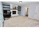 Finished basement featuring a fireplace and built-in shelving, ideal for a cozy workspace at 4257 Locust Ln, Brownsburg, IN 46112