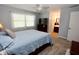 This bedroom has neutral carpet, a window for natural light and a TV with dresser at 4257 Locust Ln, Brownsburg, IN 46112
