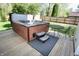 Hot tub on wooden deck, with table, chairs and mat at 4257 Locust Ln, Brownsburg, IN 46112