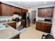 Well-equipped kitchen with stainless steel appliances, wood cabinets, and ample counter space at 4257 Locust Ln, Brownsburg, IN 46112