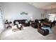 Spacious living room with vaulted ceiling, plush seating, and bright, airy feel at 4257 Locust Ln, Brownsburg, IN 46112