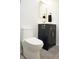 Stylish bathroom featuring a toilet and vanity with gold accents at 474 N Randolph St, Indianapolis, IN 46201