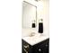 Modern bathroom showcasing a black vanity with gold hardware and a square mirror at 474 N Randolph St, Indianapolis, IN 46201
