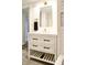 Bright bathroom features a modern vanity with a white cabinet, black hardware and a gold faucet at 474 N Randolph St, Indianapolis, IN 46201
