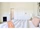 Stylish bedroom boasts a fireplace, closet, and an ensuite bathroom at 474 N Randolph St, Indianapolis, IN 46201