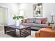 Comfortable living space with a gray sofa, patterned pillows, and modern artwork at 474 N Randolph St, Indianapolis, IN 46201