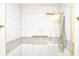 Modern shower features gold hardware, a rainfall shower head, and a built-in niche at 474 N Randolph St, Indianapolis, IN 46201