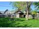 A detached garage in a grassy backyard at 480 E Walnut St, Martinsville, IN 46151
