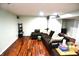 This basement features a spacious sectional couch and sleek hardwood floors at 480 E Walnut St, Martinsville, IN 46151