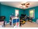A bright bedroom with ample sunlight and a ceiling fan at 480 E Walnut St, Martinsville, IN 46151