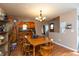 Inviting dining room with wood floors, a chandelier and a view into the kitchen at 480 E Walnut St, Martinsville, IN 46151