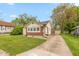Beautiful home with a driveway leading to a detached garage and a well-kept front yard at 480 E Walnut St, Martinsville, IN 46151