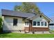 Charming home with tan siding, brick foundation, and a well-maintained lawn at 480 E Walnut St, Martinsville, IN 46151