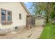 The property has a detached single car garage and driveway with greenery at 480 E Walnut St, Martinsville, IN 46151