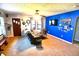 Bright living room with a blue accent wall, plush seating, and a ceiling fan at 480 E Walnut St, Martinsville, IN 46151
