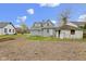 View of the home's backyard and blue clapboard siding at 524 S State St, Greenfield, IN 46140