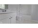Bathroom featuring a shower-tub combo and vanity with marble tiled floor at 524 S State St, Greenfield, IN 46140