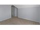 Carpeted bedroom with white trim, gray walls and a doorway in the background at 524 S State St, Greenfield, IN 46140