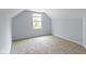 Cozy bedroom featuring neutral carpet, window, and gray walls at 524 S State St, Greenfield, IN 46140