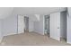 Bright bedroom with neutral carpet and access to a shower and separate toilet at 524 S State St, Greenfield, IN 46140