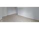 Bedroom with neutral carpeting, gray walls, and white trim at 524 S State St, Greenfield, IN 46140