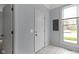 Entryway with tile floors, white door, light gray paint, and a window at 524 S State St, Greenfield, IN 46140