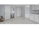 Hallway with access to a bathroom, closet and a kitchen with white cabinets at 524 S State St, Greenfield, IN 46140