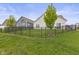 Spacious backyard with black metal fence, offering a private outdoor space at 5423 Maywood Dr, Whitestown, IN 46075