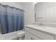 Clean bathroom featuring a shower with blue curtain and a vanity with granite countertop at 5423 Maywood Dr, Whitestown, IN 46075