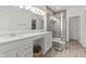 Elegant bathroom with double vanity, quartz countertop, and a glass-enclosed shower at 5423 Maywood Dr, Whitestown, IN 46075