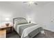 Cozy bedroom with carpet flooring, a metal bed frame, and matching side tables with lamps at 5423 Maywood Dr, Whitestown, IN 46075