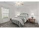 Bedroom featuring carpet flooring, a metal bed frame, and matching side tables with lamps at 5423 Maywood Dr, Whitestown, IN 46075