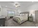 Comfortable bedroom with soft carpet, ceiling fan, and neutral finishes at 5423 Maywood Dr, Whitestown, IN 46075
