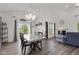 View of dining area with a modern table, stylish lighting, and open layout at 5423 Maywood Dr, Whitestown, IN 46075