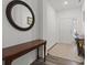Bright foyer featuring hardwood floors, elegant furnishings, and a welcoming atmosphere at 5423 Maywood Dr, Whitestown, IN 46075