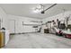 Spacious two-car garage with ample storage cabinets and space for tools and equipment at 5423 Maywood Dr, Whitestown, IN 46075