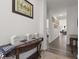 Elegant hallway with hardwood floors and tasteful décor leads to various rooms in the home at 5423 Maywood Dr, Whitestown, IN 46075
