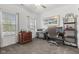 Bright home office with neutral carpet, and many windows providing natural light at 5423 Maywood Dr, Whitestown, IN 46075