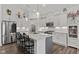 An open kitchen featuring stainless steel appliances, quartz countertops, and decorative pendant lights at 5423 Maywood Dr, Whitestown, IN 46075