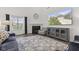 Cozy living room features a fireplace, plush seating, and a stylish rug at 5423 Maywood Dr, Whitestown, IN 46075
