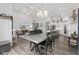 Open concept design: view of the kitchen, dining area and living room of a bright, modern home at 5423 Maywood Dr, Whitestown, IN 46075