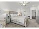 Comfortable main bedroom featuring soft carpet, a ceiling fan, and neutral finishes at 5423 Maywood Dr, Whitestown, IN 46075